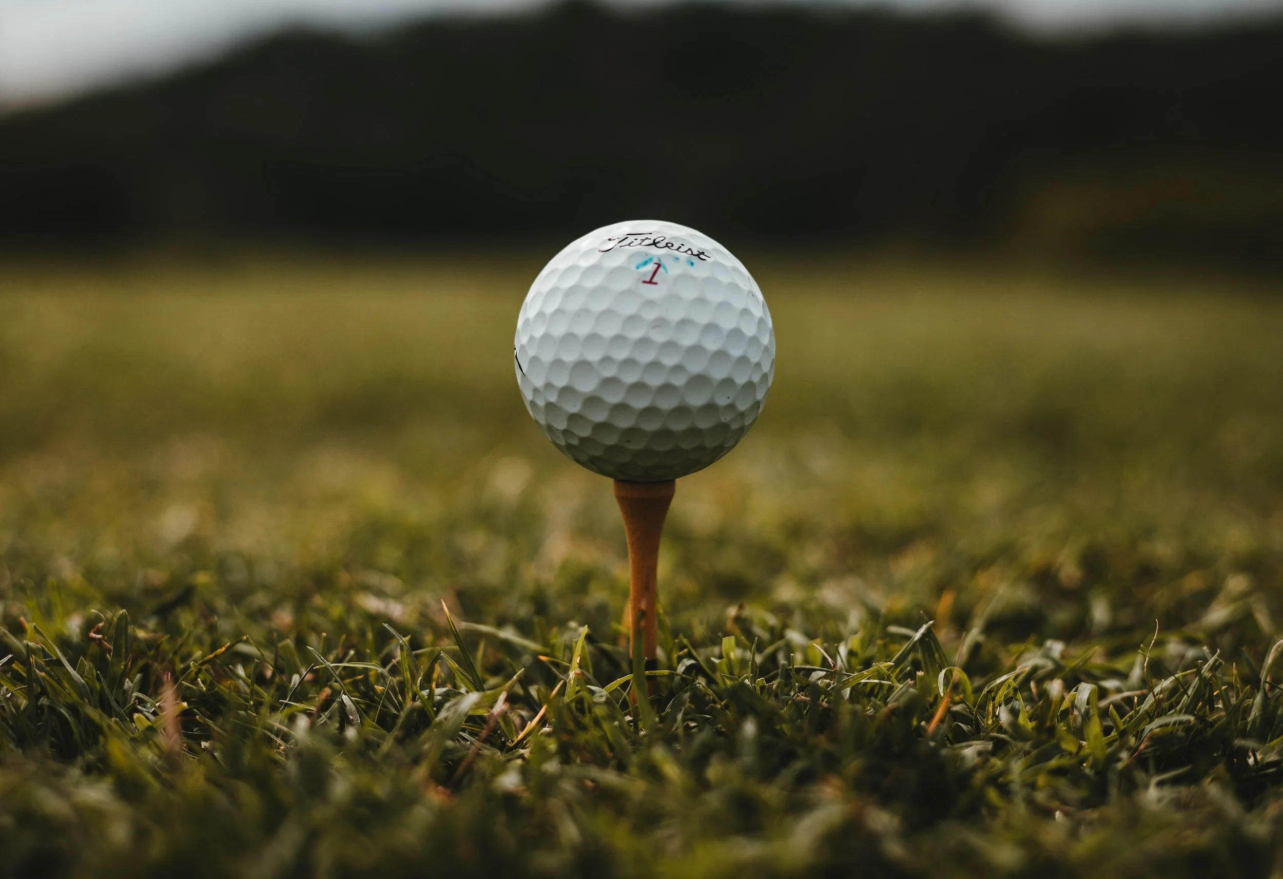 Golfer teeing off at a golf course